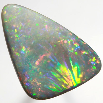 SOLID SEMI BLACK OPAL Very unual opal with an exploding rainbow. SEE VIDEO  